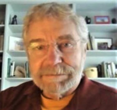ACC1.5.pg Alan in his office with rust colored shirt